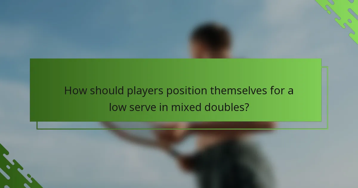 How should players position themselves for a low serve in mixed doubles?